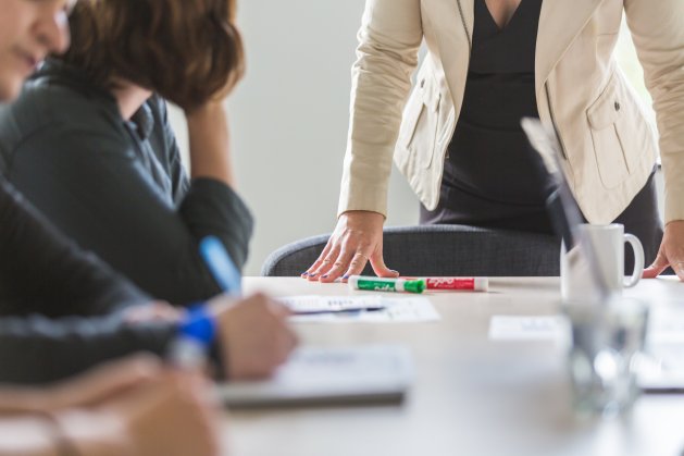 powerful-woman-leaning-on-desk_4460x4460